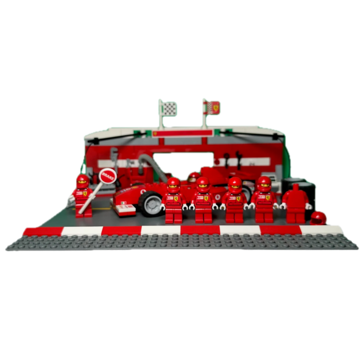 LEGO model of a race car garage with figures