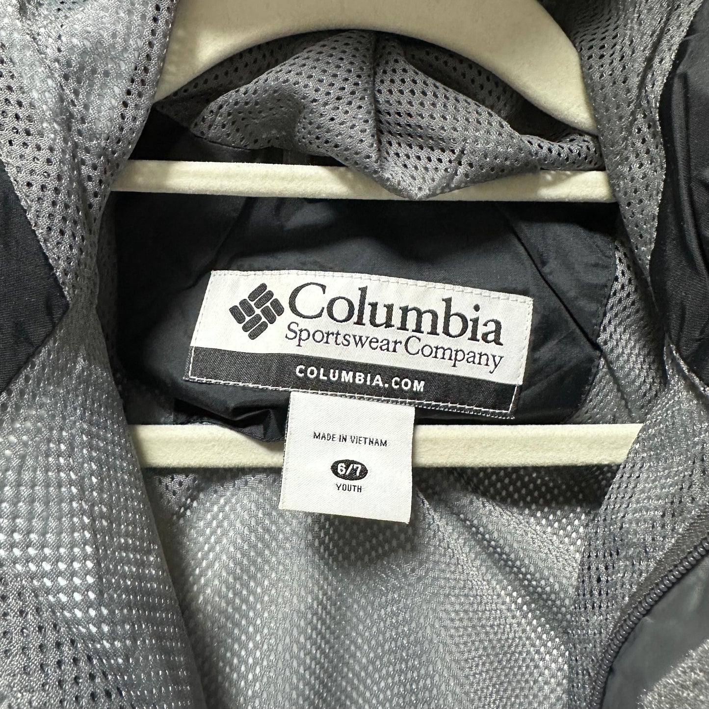 Columbia Sportswear Company label on a piece of gray fabric