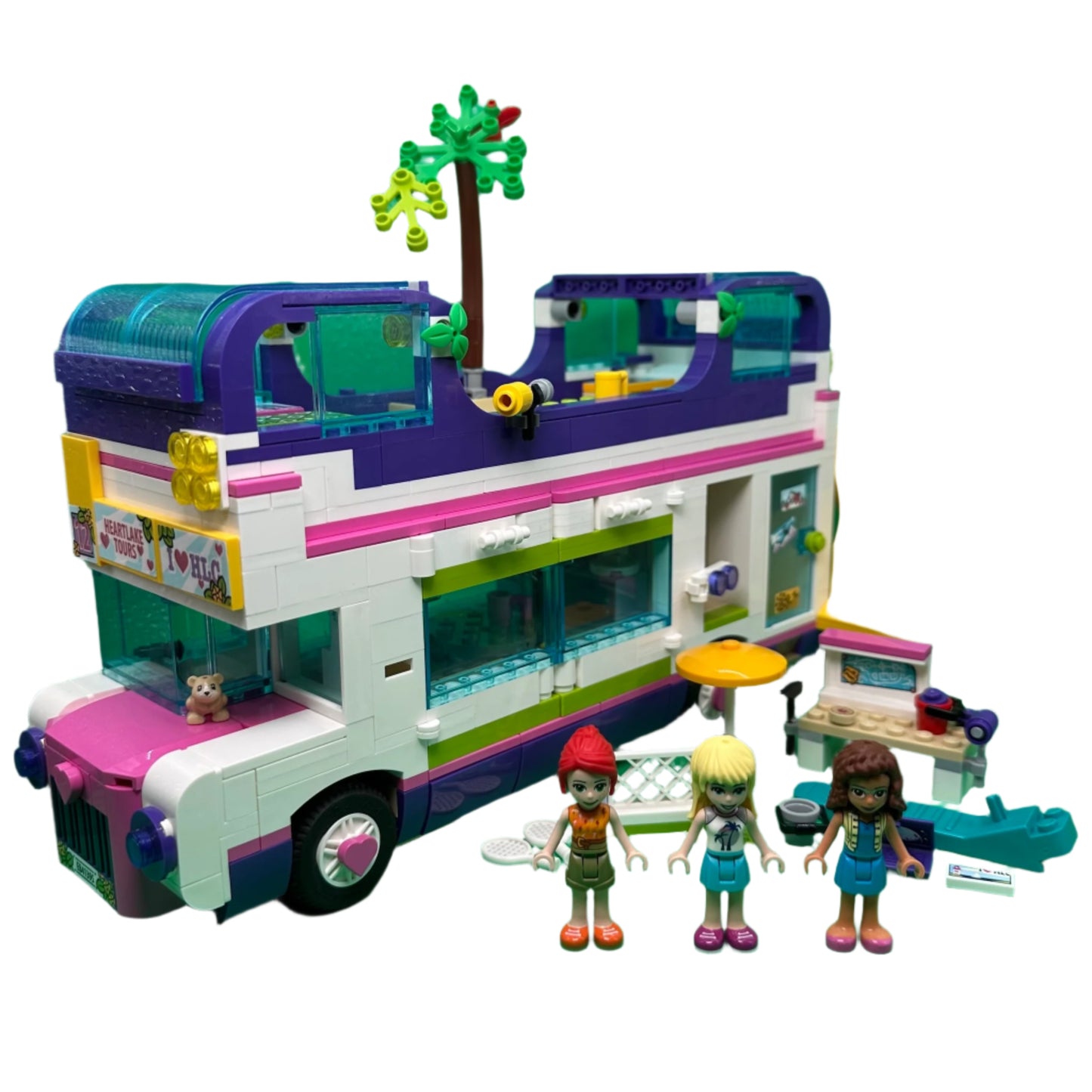 Toy bus with colourful design and three figures