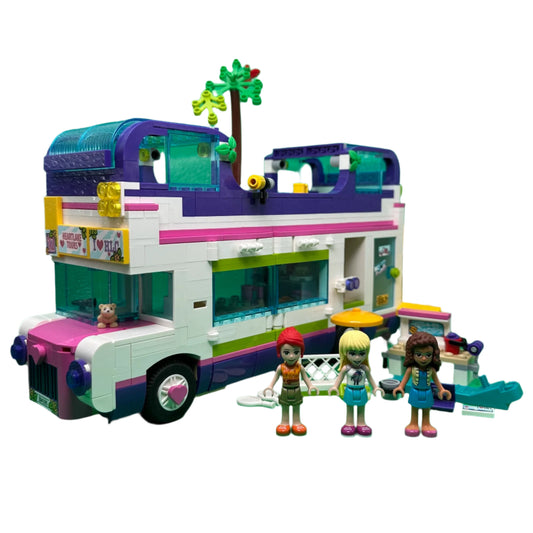 Colourful toy bus with three dolls
