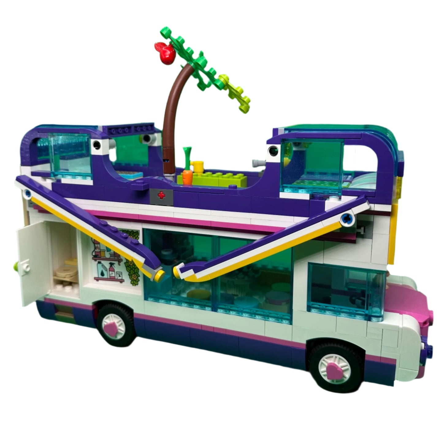 Toy bus with a purple roof and greenery