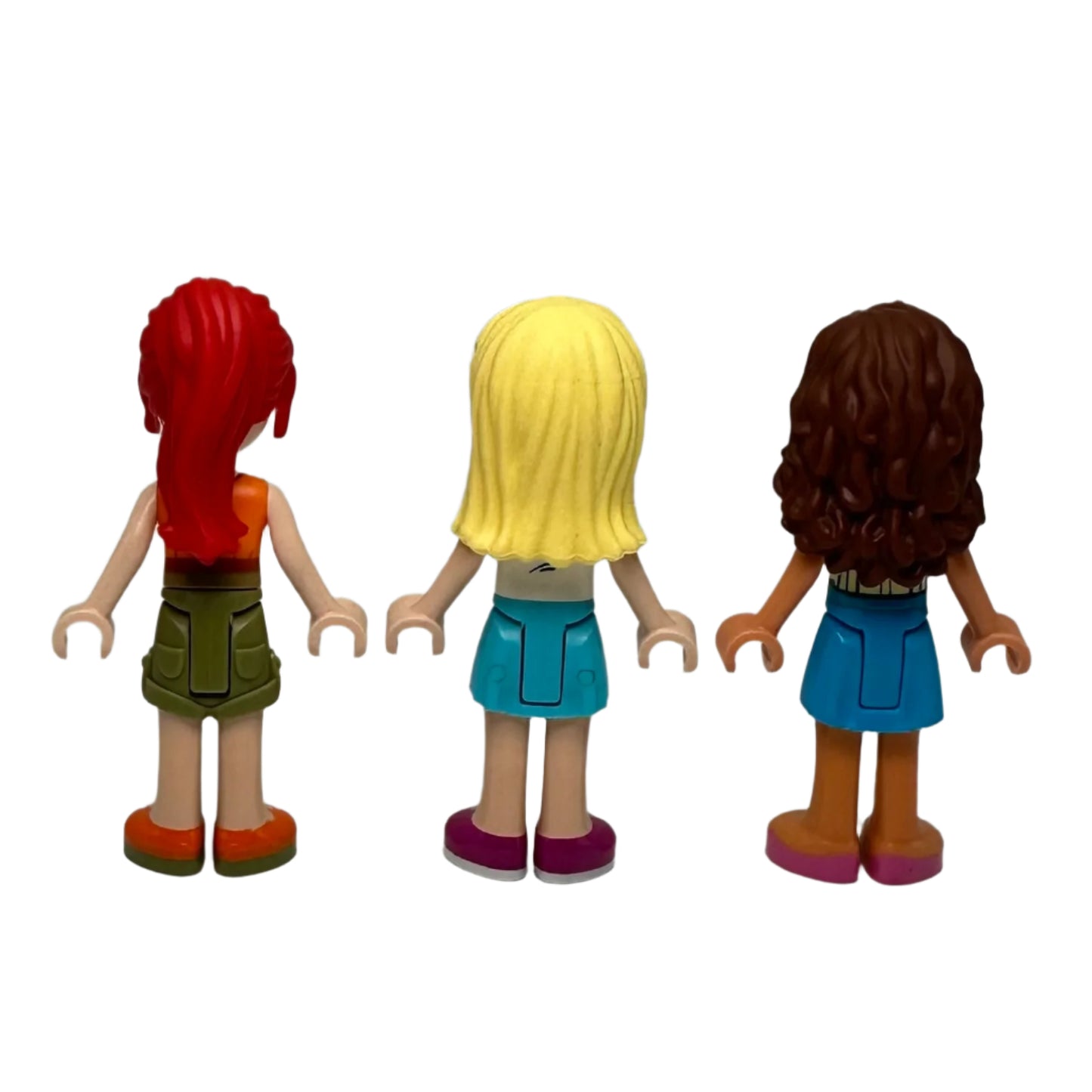 Three lego minifigures with different hair colours