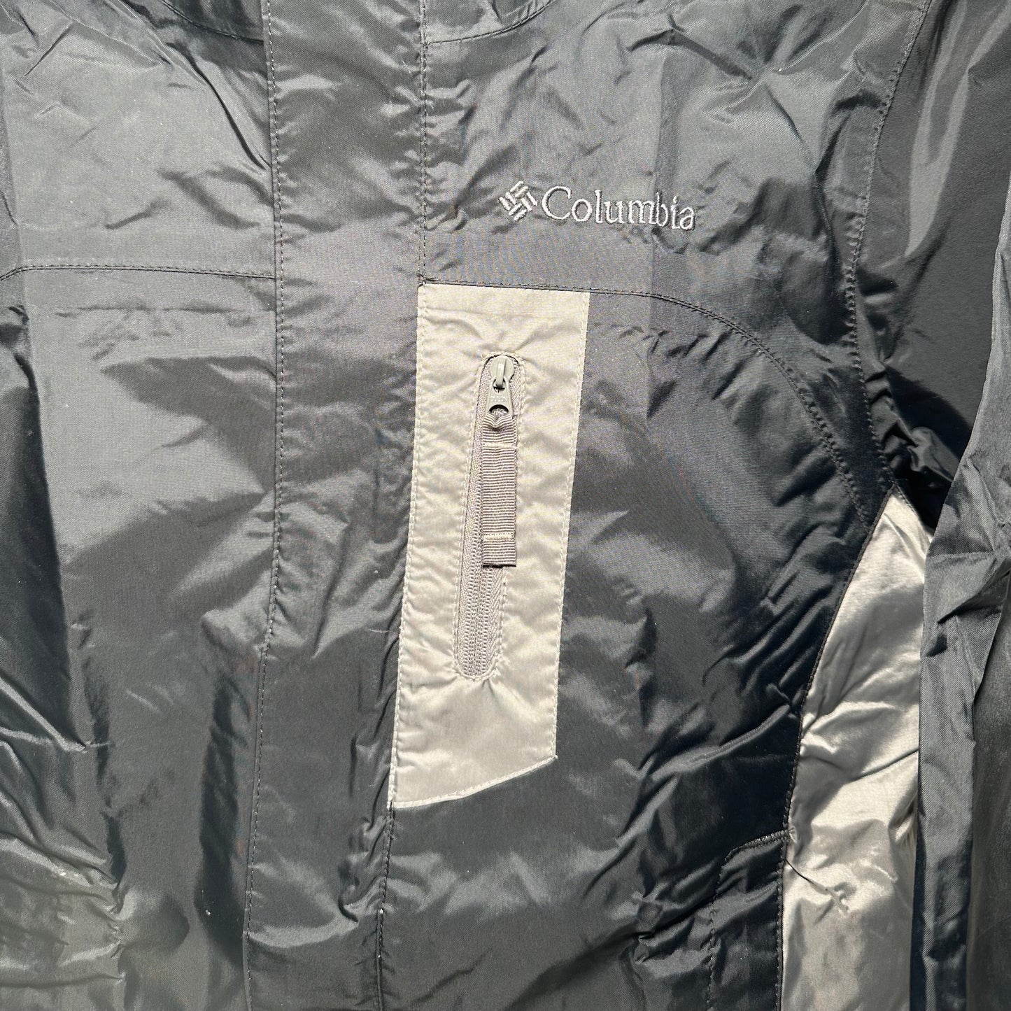 Close-up of a Columbia jacket with a focus on the brand logo.