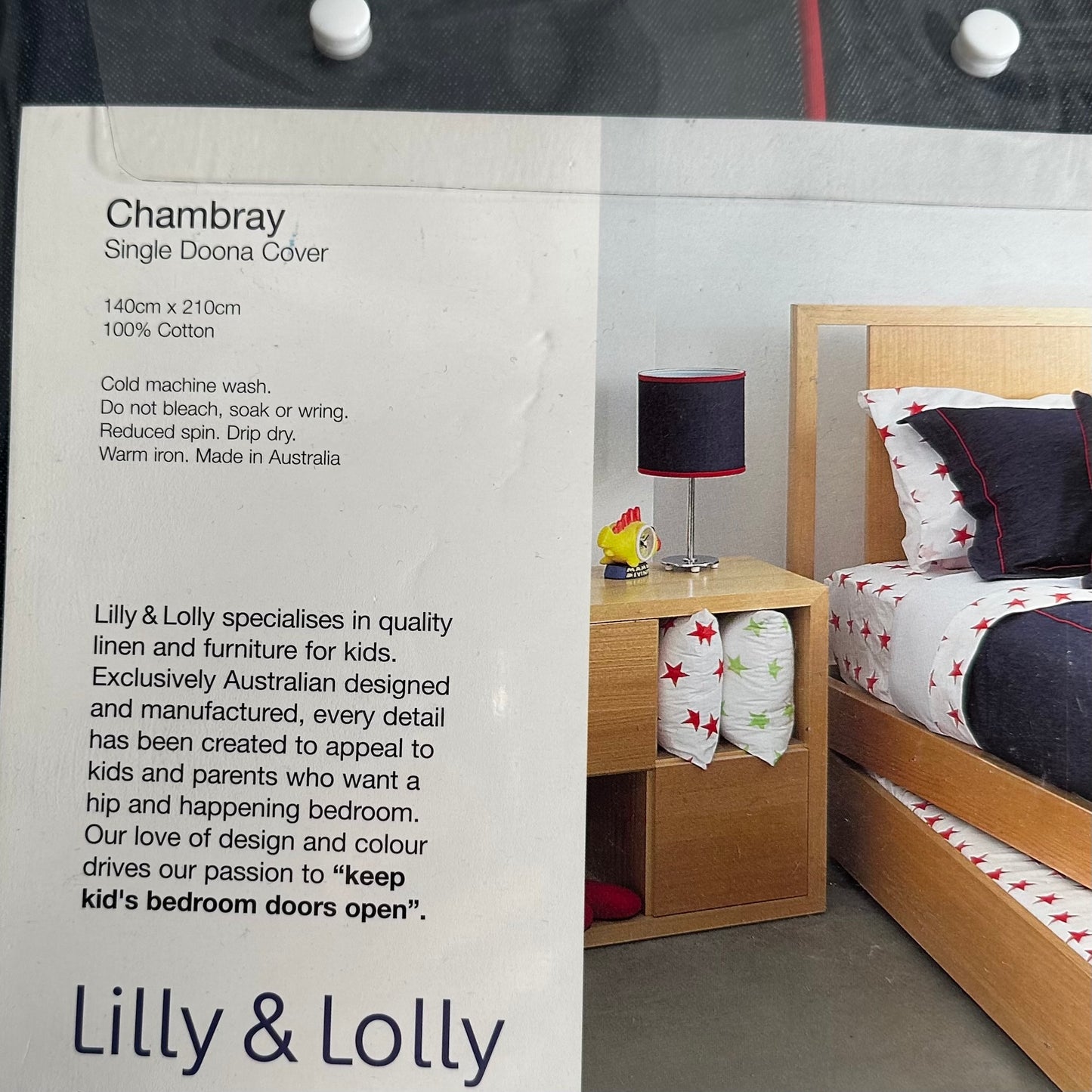 Bedroom scene with wooden bed and nightstand, featuring Lily & Lolly bedding and furniture.