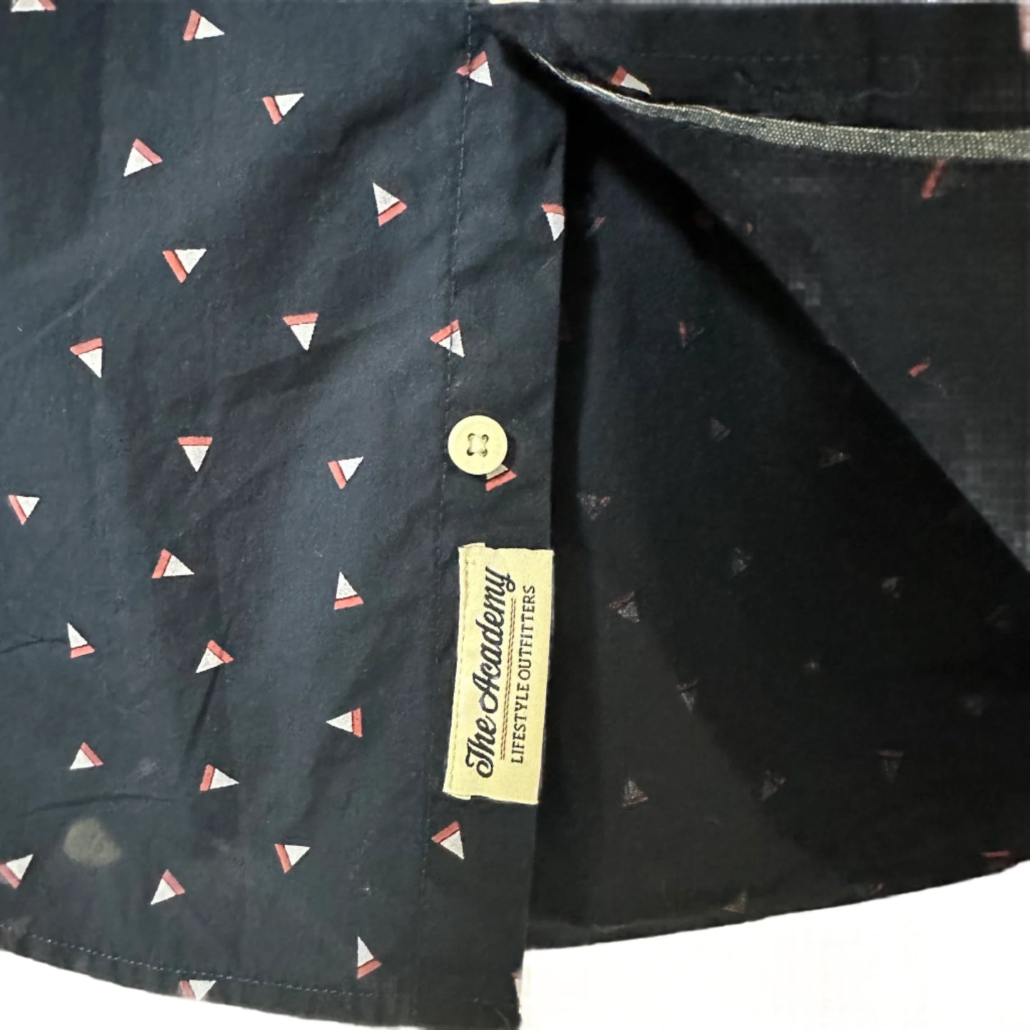 Close-up of a navy shirt with small geometric pattern